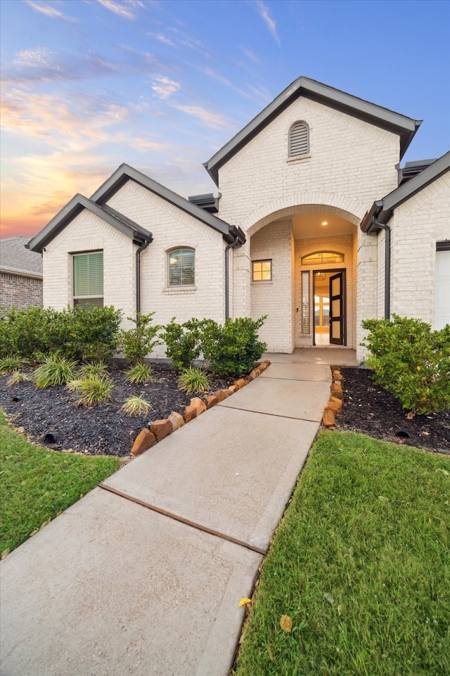 view of front of house with a yard