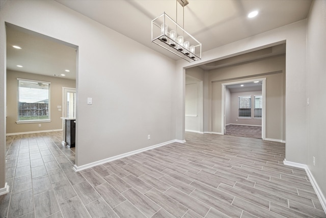 unfurnished dining area with light hardwood / wood-style flooring and a healthy amount of sunlight