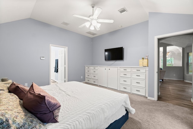 carpeted bedroom featuring ceiling fan and vaulted ceiling