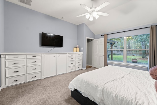 bedroom with light colored carpet, ceiling fan, and vaulted ceiling