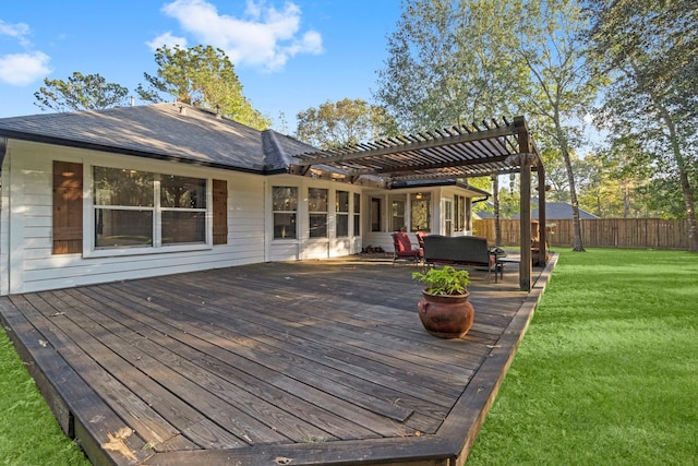 wooden terrace with a lawn, a pergola, and an outdoor living space