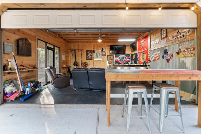 interior space with a workshop area and wooden walls