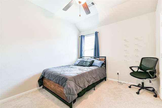 carpeted bedroom featuring ceiling fan and vaulted ceiling