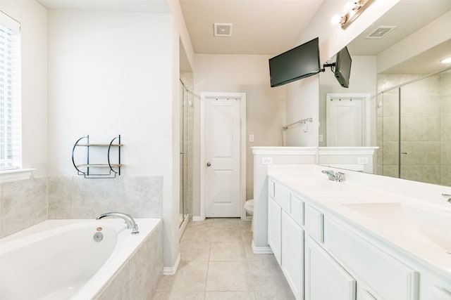 full bathroom with vanity, shower with separate bathtub, toilet, and tile patterned floors