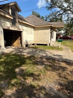 view of side of property featuring a garage