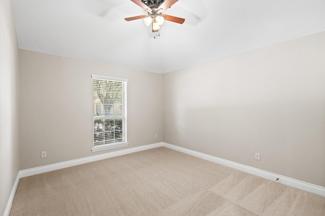 unfurnished room featuring light colored carpet and ceiling fan