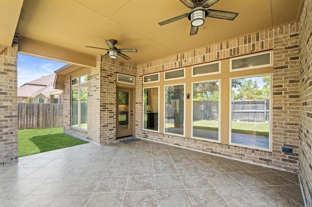 view of patio featuring ceiling fan