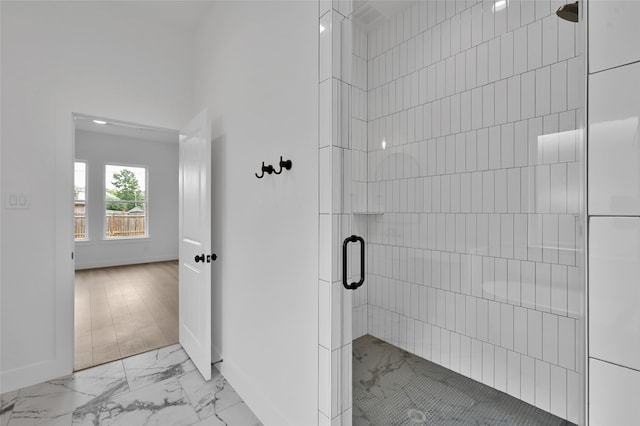 bathroom featuring an enclosed shower and hardwood / wood-style floors