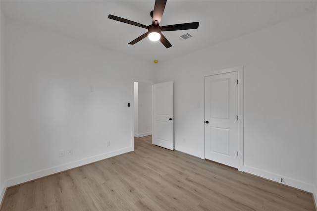 unfurnished bedroom with light wood-type flooring and ceiling fan