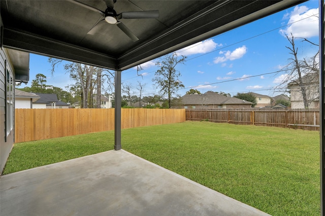 view of yard with a patio area and ceiling fan