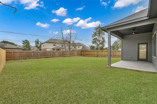 view of yard featuring a patio and ceiling fan