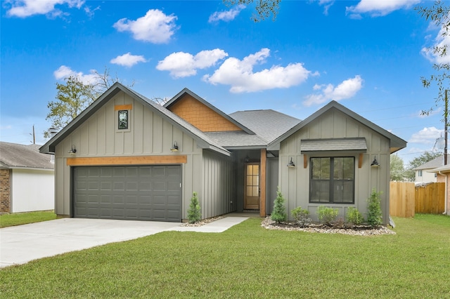 view of front of house with a garage and a front lawn