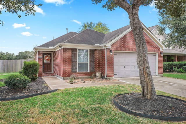 view of front of home featuring a garage and a front lawn