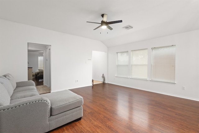 living room with ceiling fan, wood-type flooring, and lofted ceiling