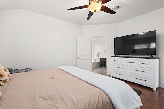 bedroom featuring ensuite bath, lofted ceiling, dark wood-type flooring, and ceiling fan