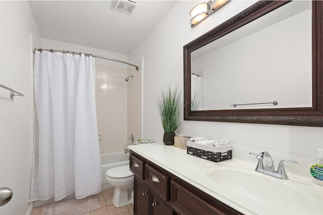 full bathroom featuring vanity, shower / bath combo with shower curtain, toilet, and tile patterned flooring