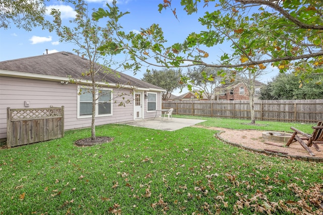 view of yard featuring a patio and an outdoor fire pit