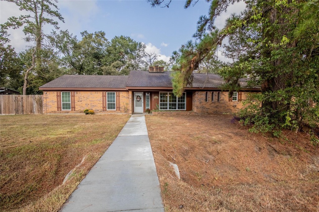 13343 Pine Dr, Cypress, TX 77429 - ranch-style home featuring a front yard