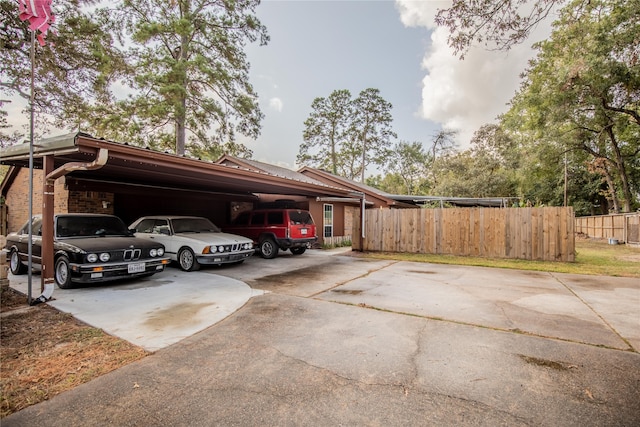 view of parking / parking lot with a carport