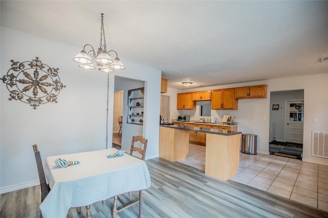 dining area featuring sink and light hardwood / wood-style flooring