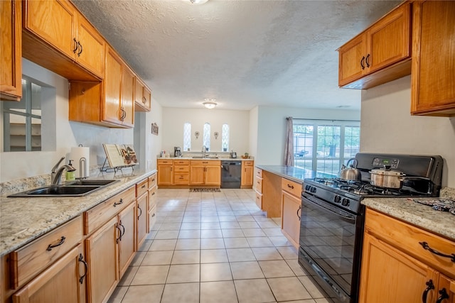 kitchen with black appliances, sink, a textured ceiling, light stone counters, and light tile patterned floors