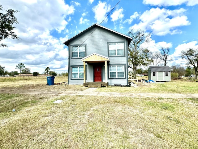 view of front of house featuring a shed