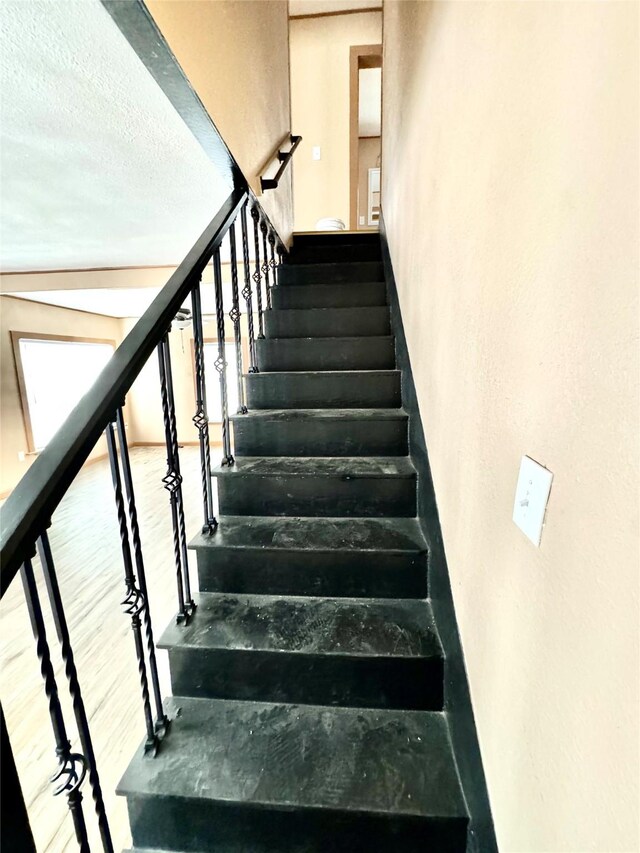 106 E Main St E, Wortham, TX 76693 - staircase with wood finished floors