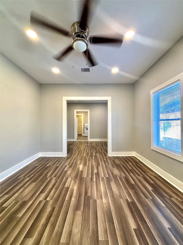 empty room featuring dark hardwood / wood-style floors and ceiling fan