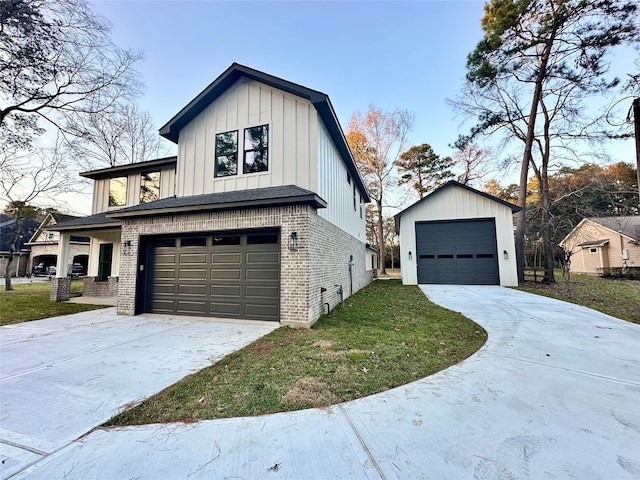 view of front of house featuring a garage and a front lawn