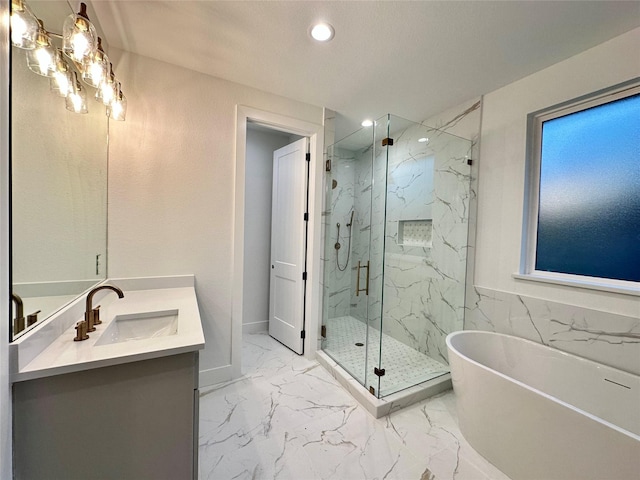 bathroom featuring vanity and independent shower and bath