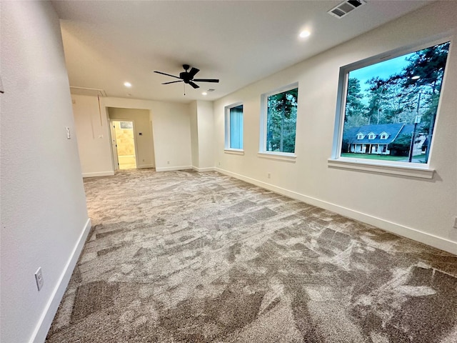 spare room with carpet floors and ceiling fan