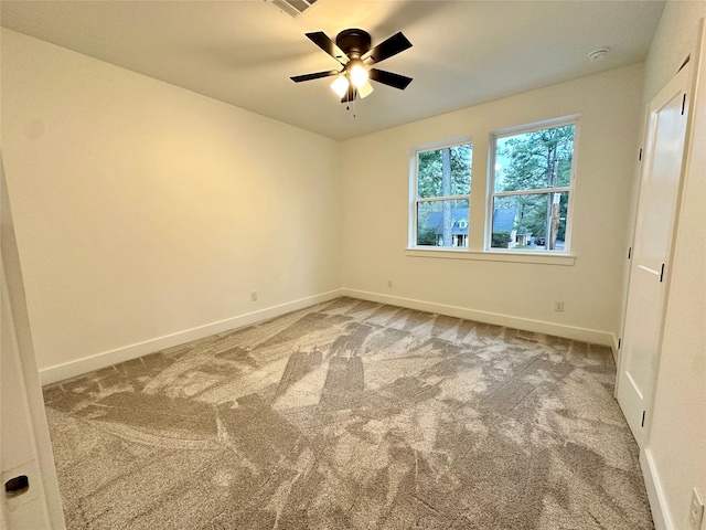 carpeted empty room with ceiling fan