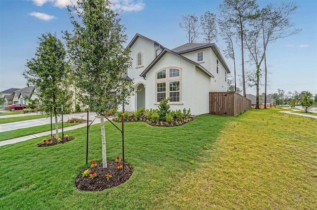 view of side of home featuring a yard