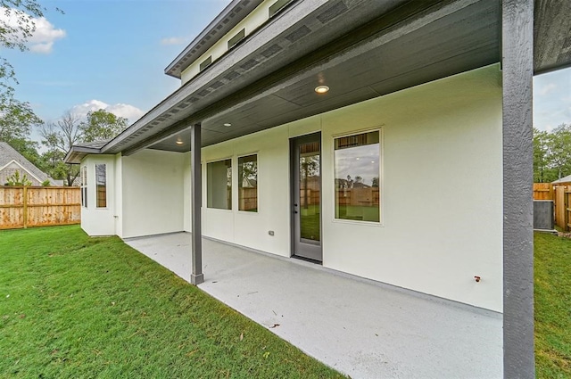 exterior space with a yard and a patio area