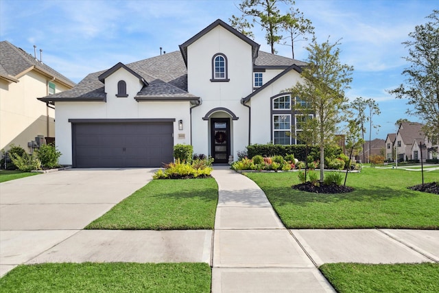 view of front of home featuring a garage and a front yard