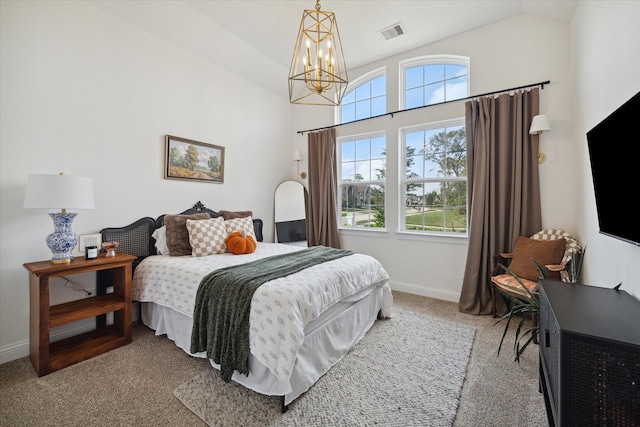 carpeted bedroom with lofted ceiling and an inviting chandelier