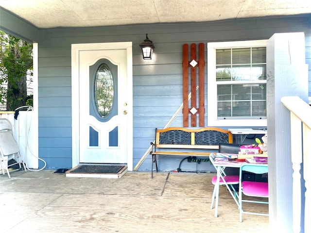 property entrance featuring covered porch