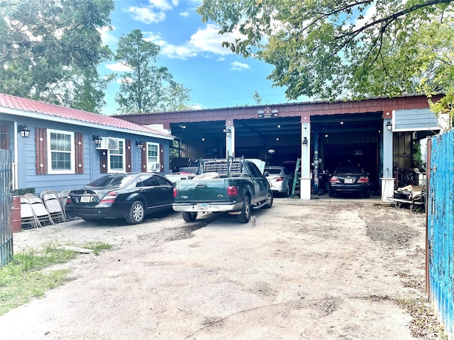 view of car parking with a garage