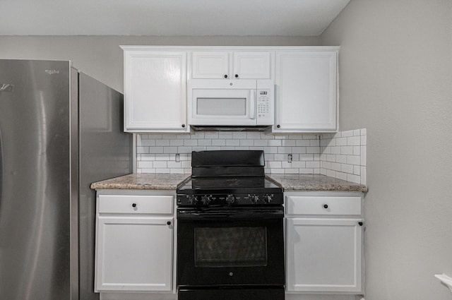 kitchen featuring backsplash, white cabinets, stainless steel fridge, and black range with electric cooktop