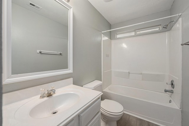 full bathroom featuring vanity, toilet, shower / bathtub combination, and wood-type flooring