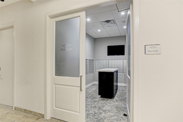 bathroom featuring a drop ceiling