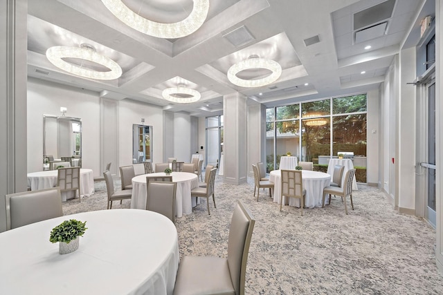 dining room featuring carpet flooring, beam ceiling, an inviting chandelier, and coffered ceiling