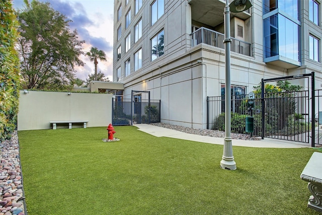 yard at dusk with a balcony