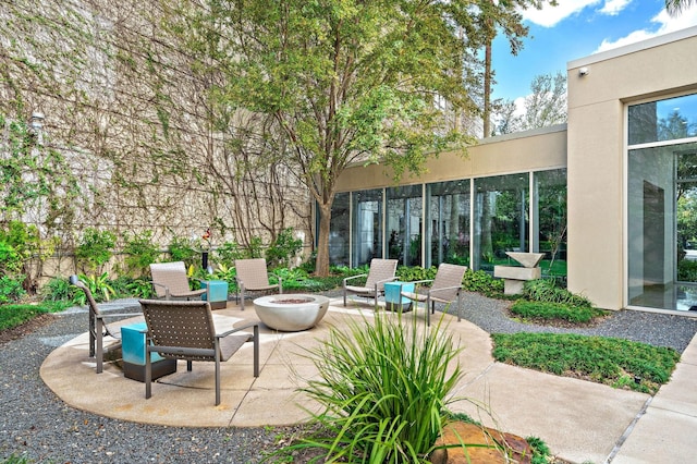 view of patio featuring a fire pit