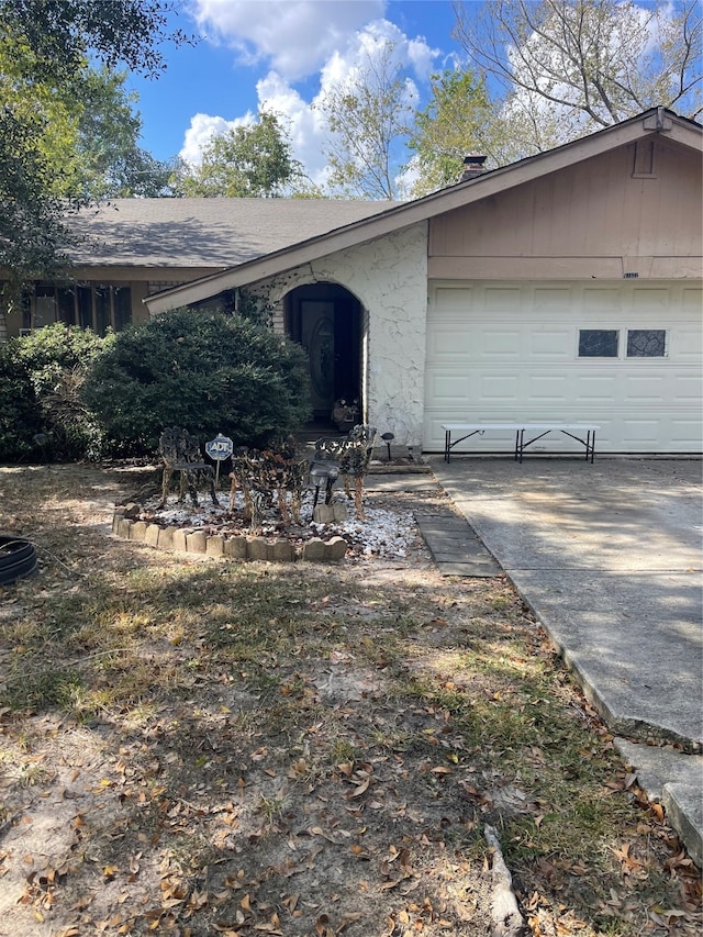 view of property exterior featuring a garage