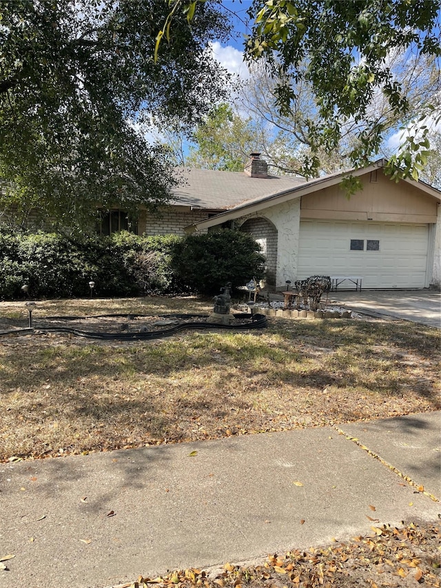 view of side of property featuring a garage