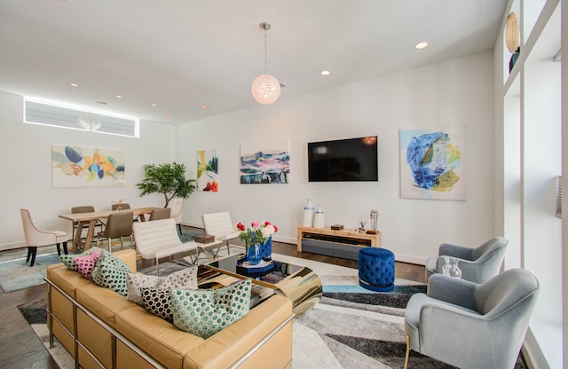 living room with hardwood / wood-style floors and a healthy amount of sunlight