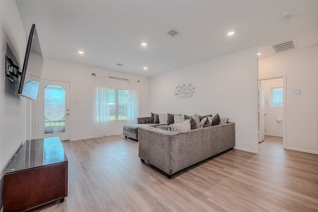 living room with light hardwood / wood-style floors