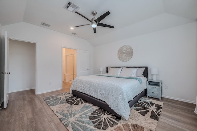 bedroom featuring ceiling fan, wood-type flooring, and vaulted ceiling