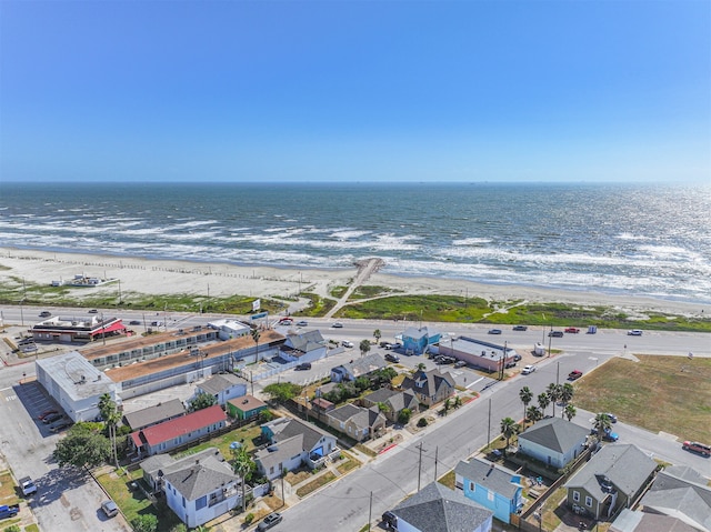 birds eye view of property featuring a view of the beach and a water view